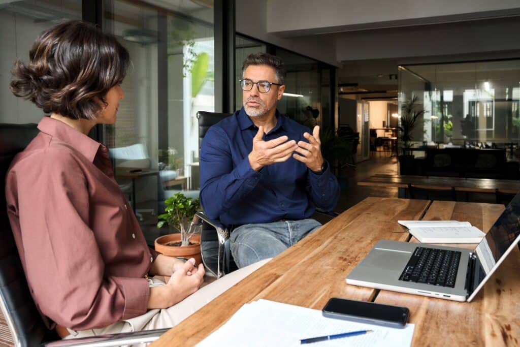 Workplace leader coaching an employee to become an executive leader